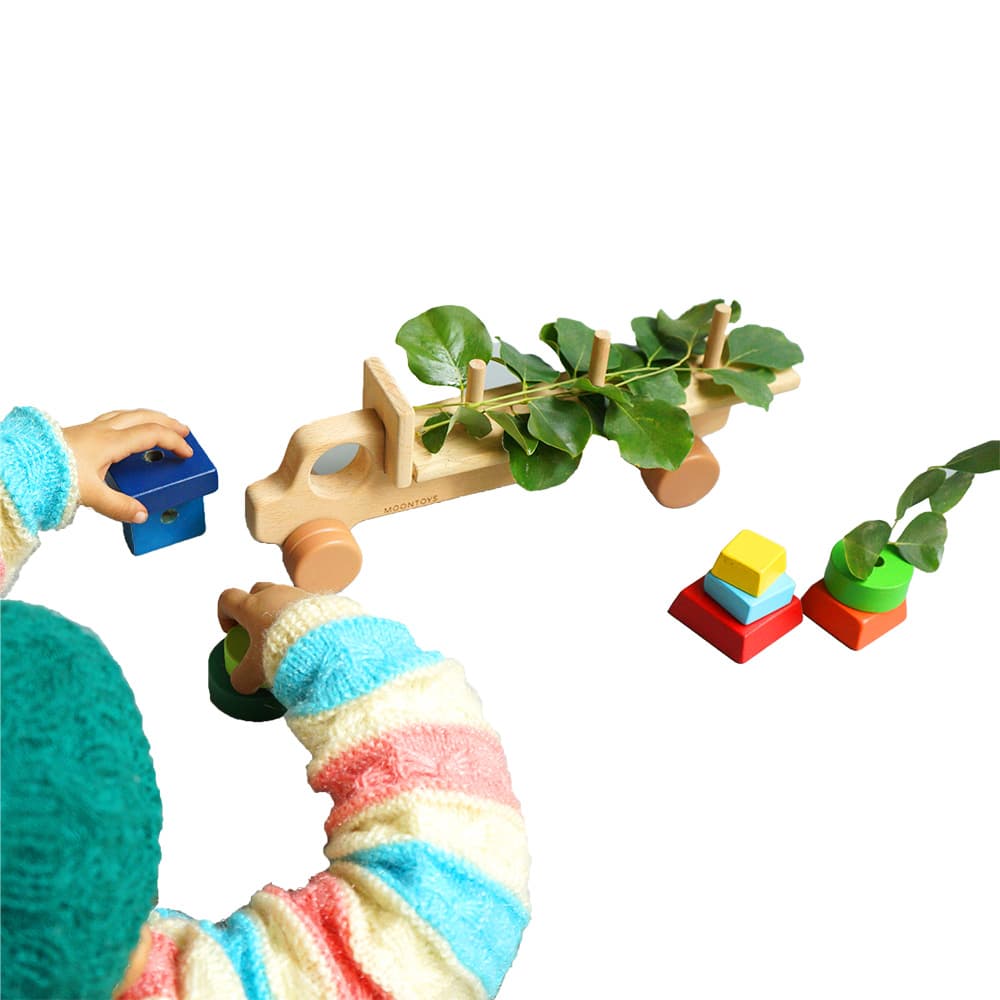 Playing baby with shape stacker truck